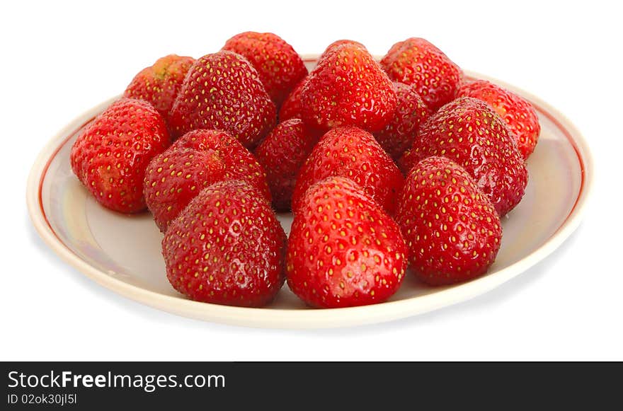 Strawberry on a saucer on a white background