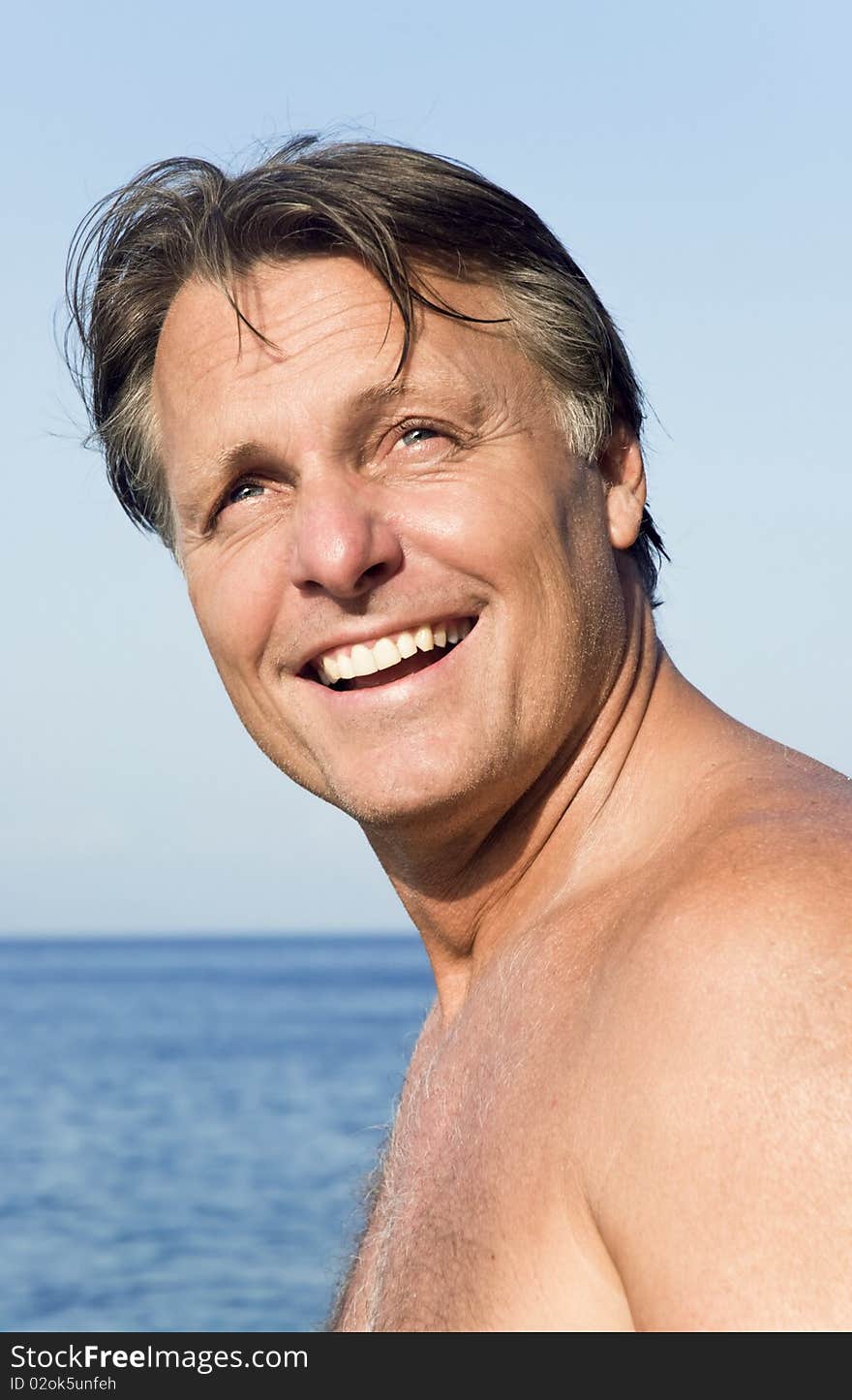 Happy man on the beach