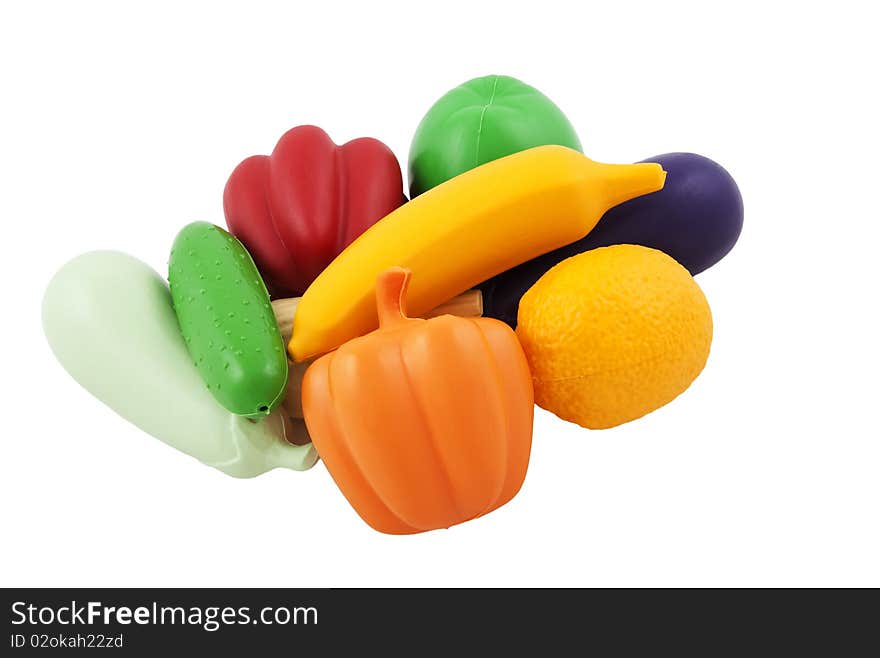 Fake vegetables and fruits isolated on white