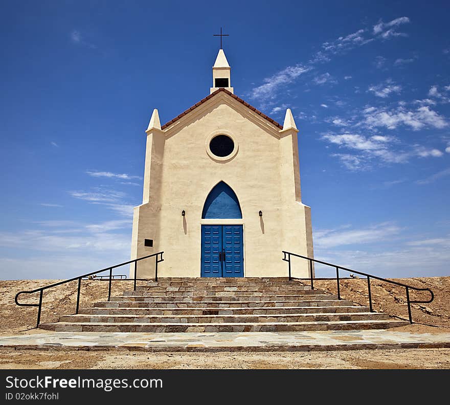 Small church with blue doors located in the desert. Small church with blue doors located in the desert