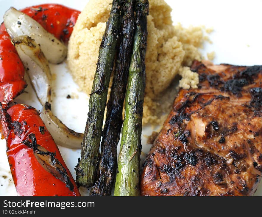 Salmon with fresh asparagus, couscous  and red peppers. Salmon with fresh asparagus, couscous  and red peppers.