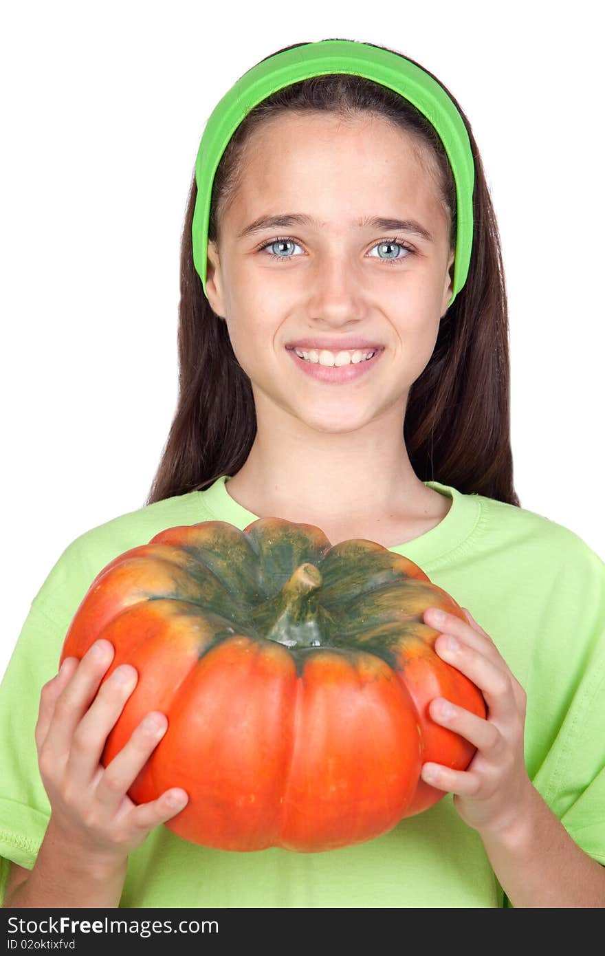 Happy girl in Halloween with a big pumpkin isolated on white background