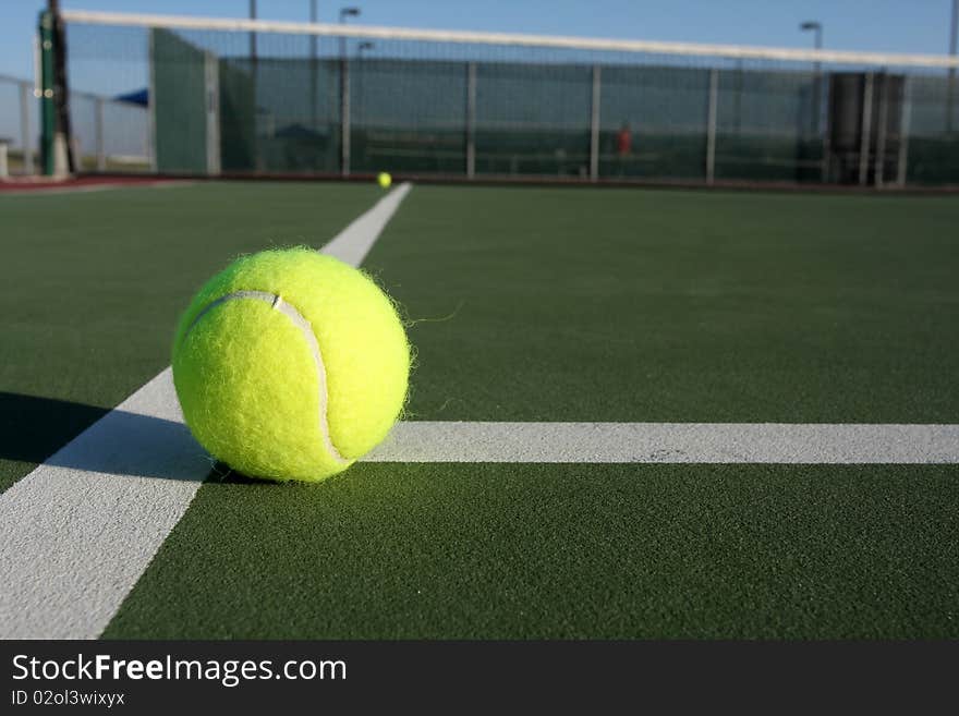 Tennis Balls On The Court