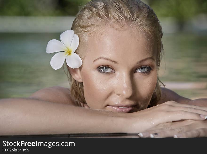 Portrait of young attractive woman having good time swimming pool. Portrait of young attractive woman having good time swimming pool