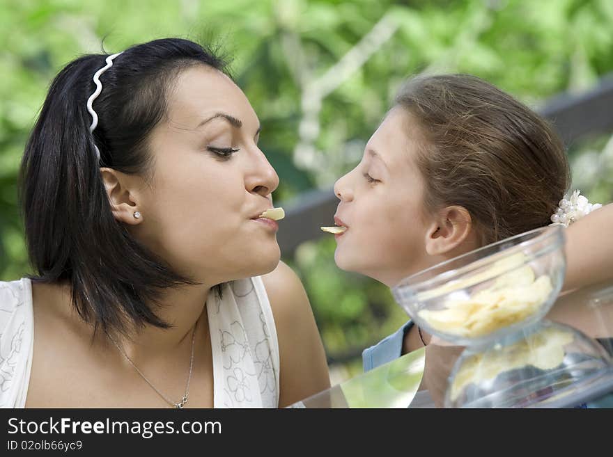 Portrait of young woman having good time with her daughter. Portrait of young woman having good time with her daughter