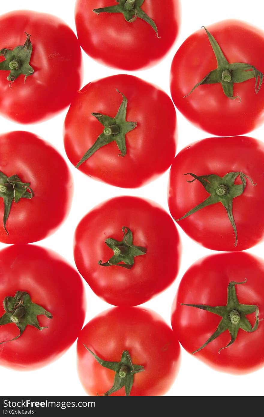 Red tomatoes on a white background, it is isolated. Red tomatoes on a white background, it is isolated.