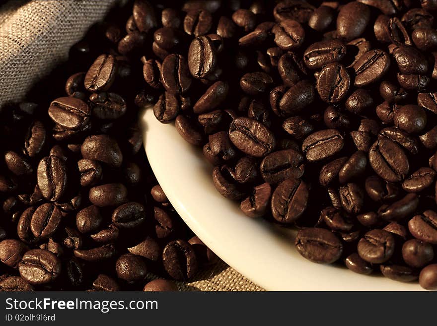 Coffee grains exit from the cup