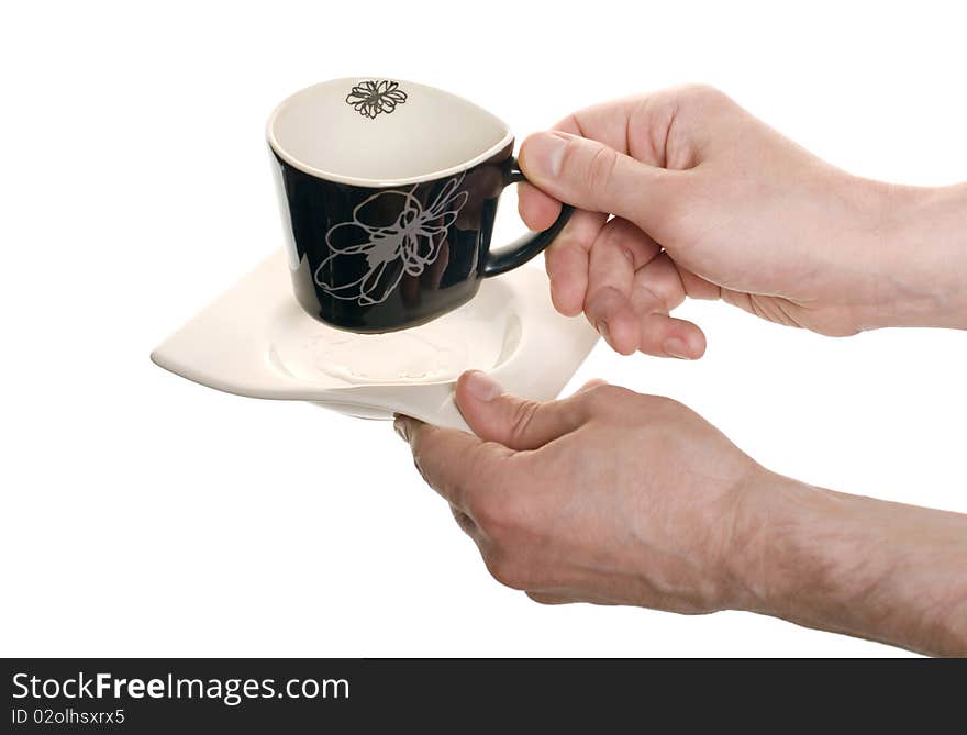 Well shaped hands with a empty coffee cup isolated over white. Well shaped hands with a empty coffee cup isolated over white