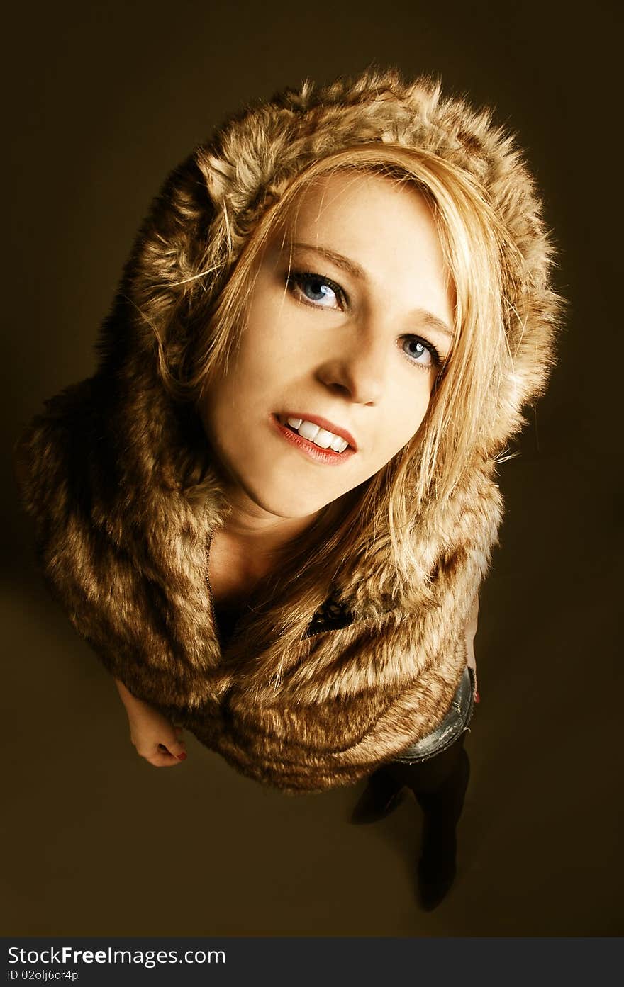 Young elegant girl with fur coat. Studio portrait. Young elegant girl with fur coat. Studio portrait