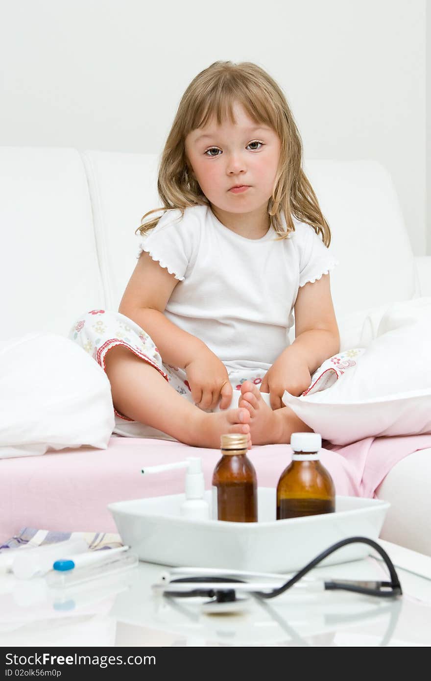 Sick little girl  on bed