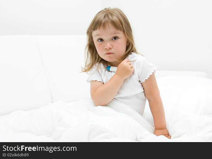 Sick little girl  on bed