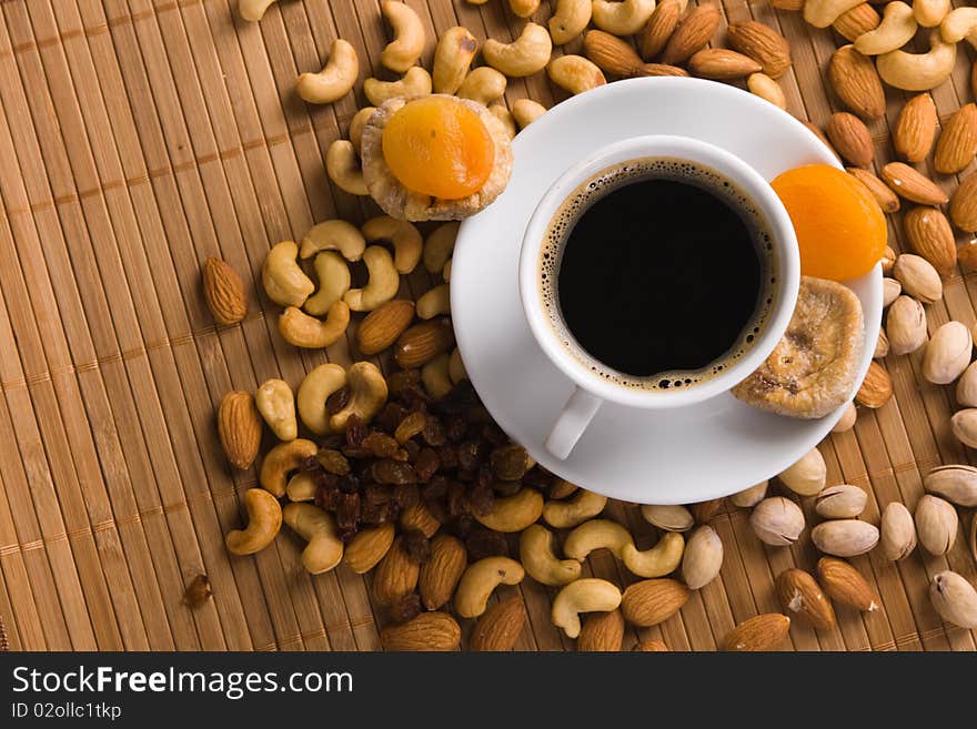 Coffee with nuts, fig and dried apricots