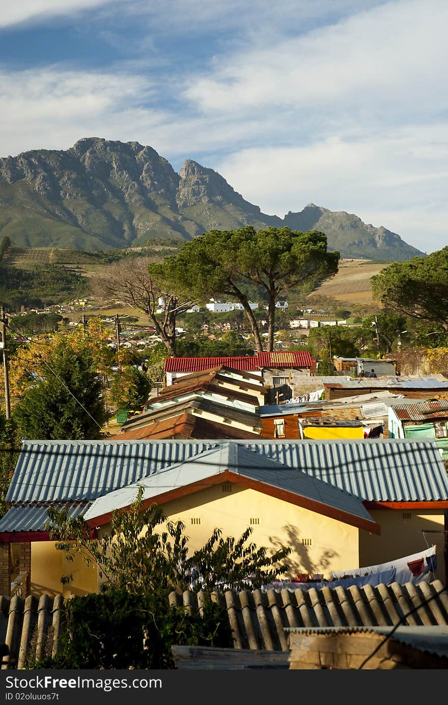 The roofs of various houses in a township in Stellenbosch, in South Africa. The roofs of various houses in a township in Stellenbosch, in South Africa