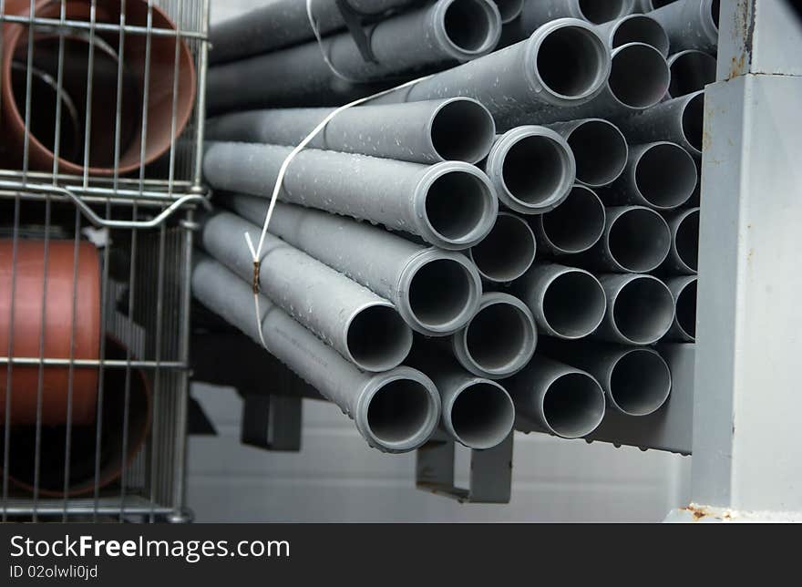 Stack of draining pipes in a store