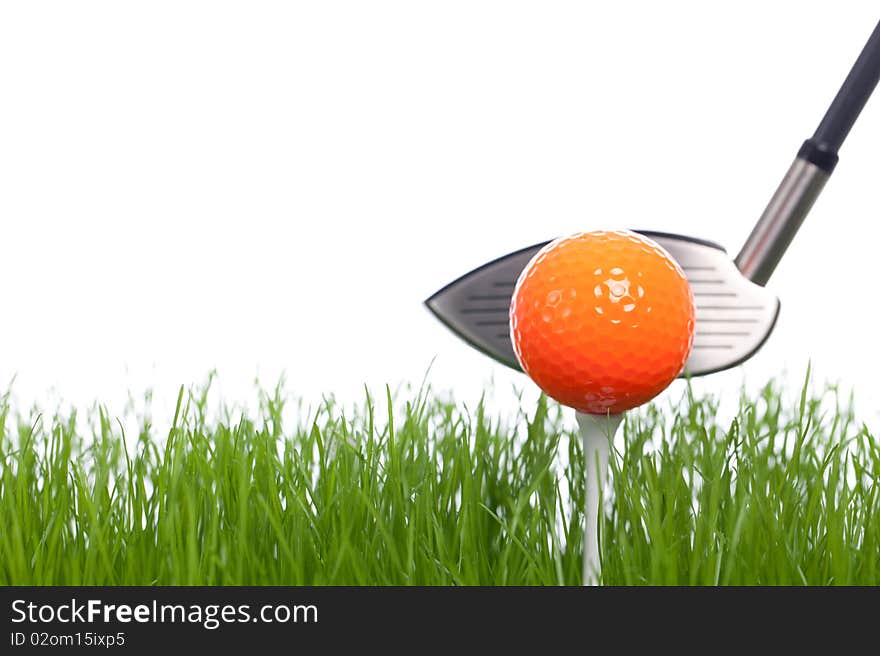 Isolated Golfball and Golfclub on a white backgorund with some green.