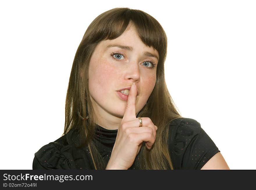 Girl with finger near by lip insulated on white background. Girl with finger near by lip insulated on white background