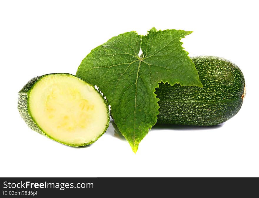 Zucchin and leaf isolated on white background