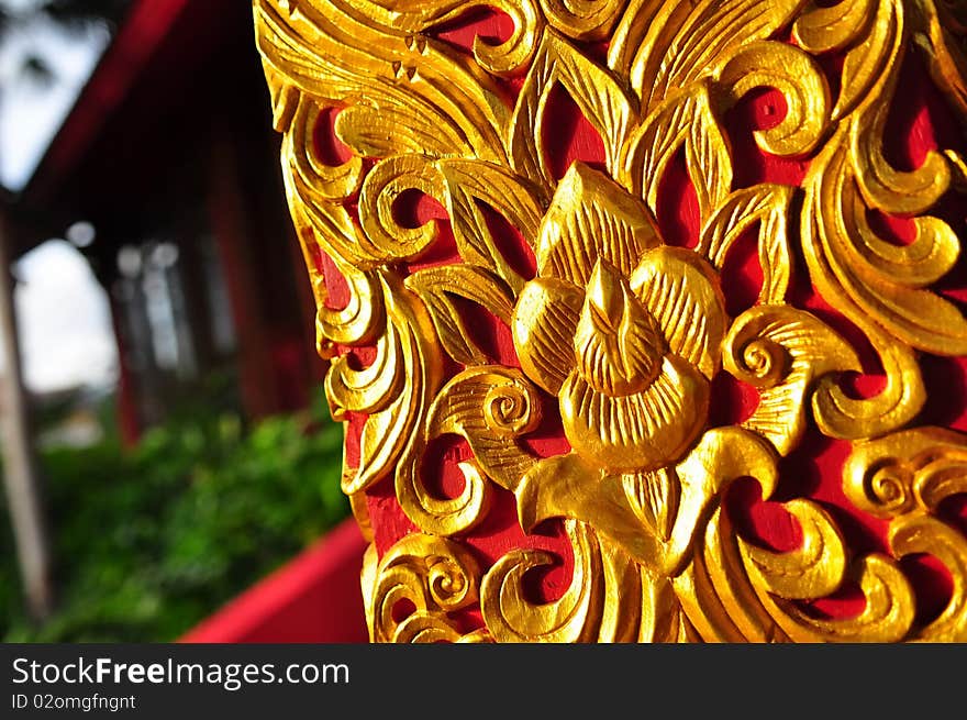 Embossed traditional flowers and leaves design on a building column. Embossed traditional flowers and leaves design on a building column