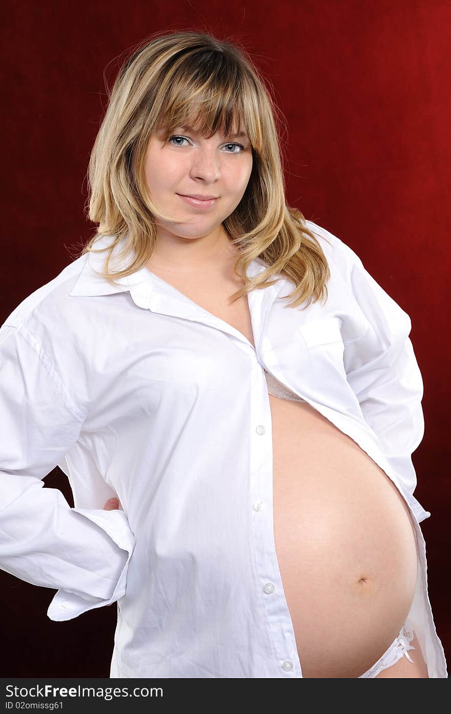 Pregnant woman  on a red background