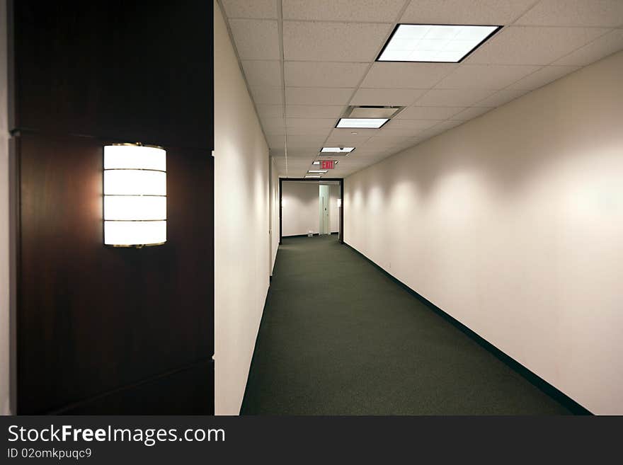 Empty office building hallway after hours