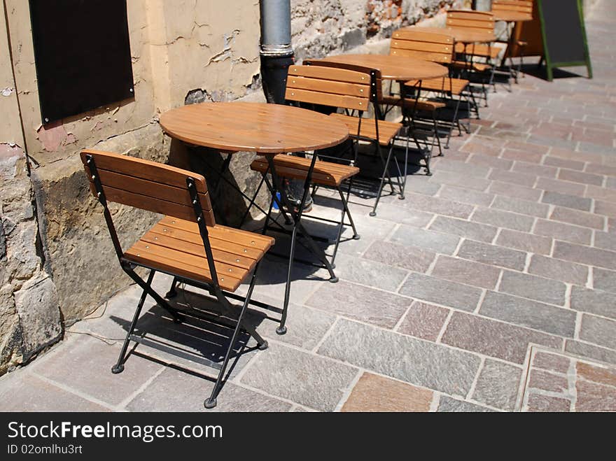 Wooden chairs over the table in little restaurant