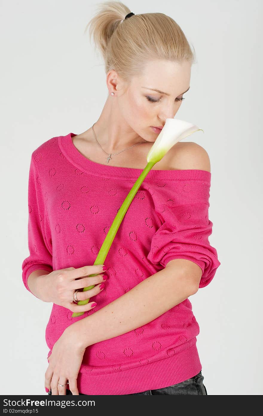 Beautiful woman with flower at studio