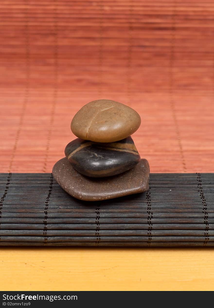 Stacked Stones On Bamboo