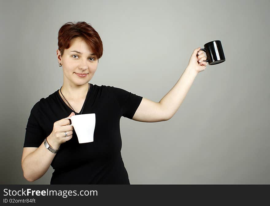 A girl with two cups, black and white. A girl with two cups, black and white