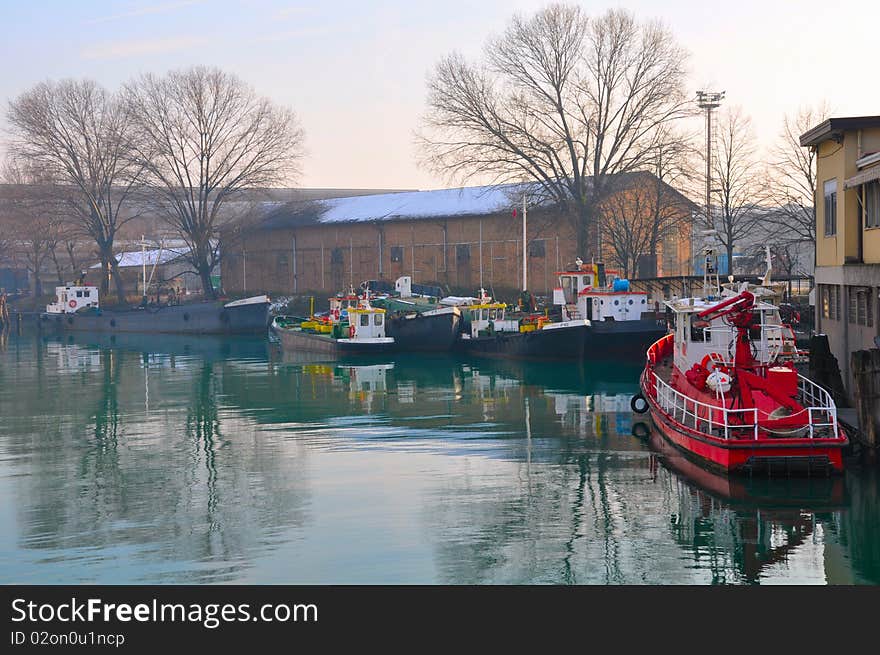 Winter. Italy. Little ships in quiet bay.