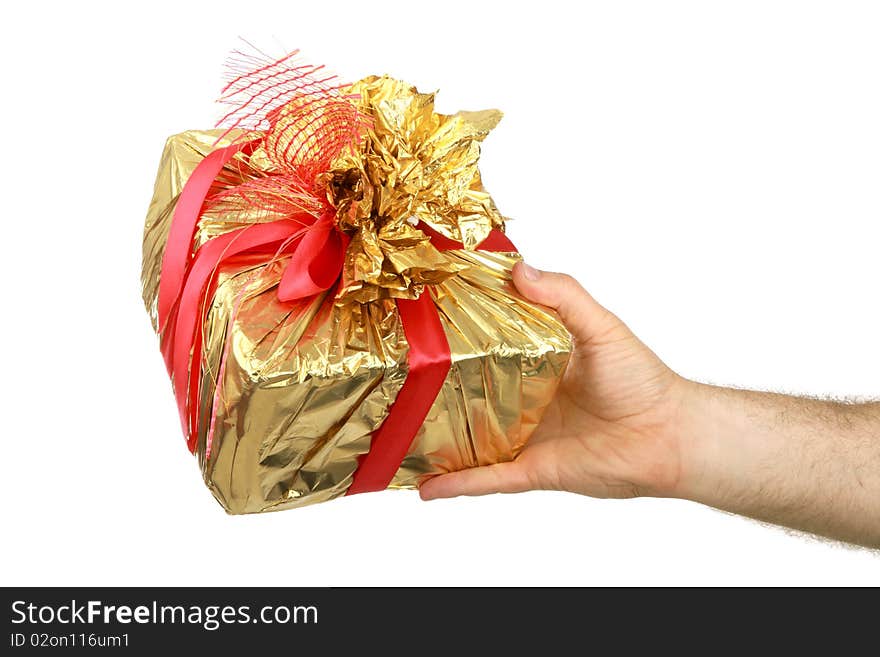 The man's hand holds a gift a box, is isolated on a white background