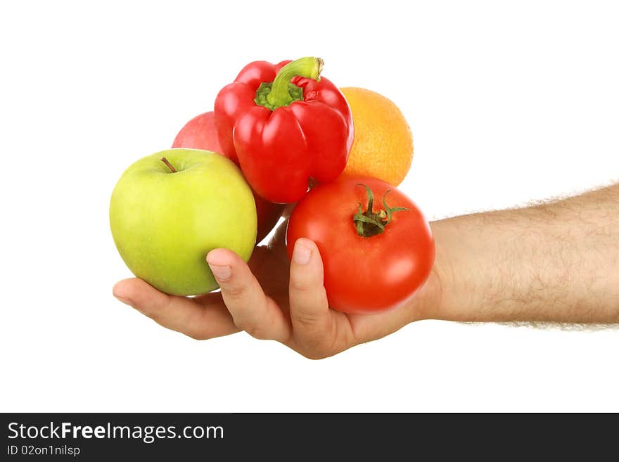 The man's hand holds fruit, is isolated on a white background