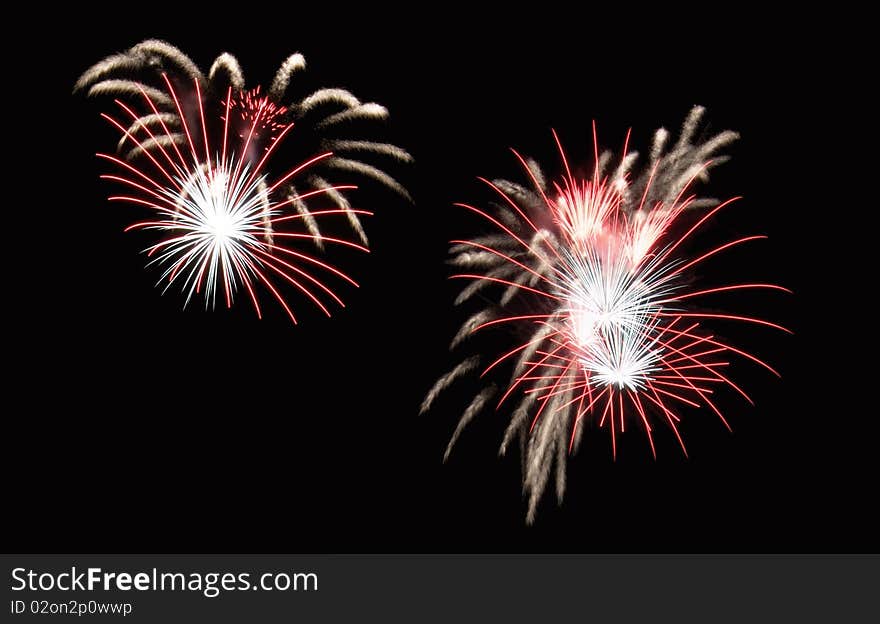 Fountain fireworks creating red and white shower effects. Fountain fireworks creating red and white shower effects.