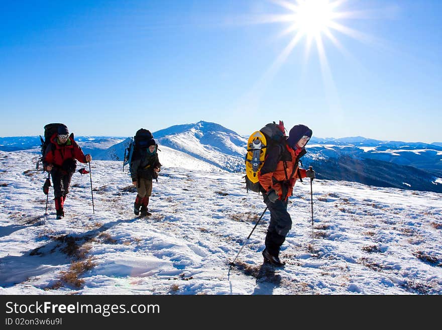 Hiker in winter in mountains