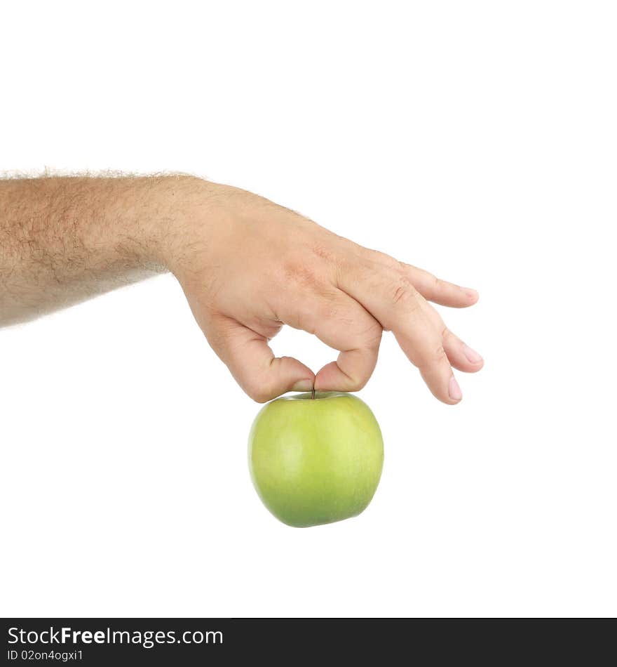 The man's hand hold a green apple, is isolated on a white background