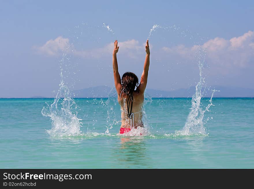 Girl with long hair playing in the sea. Girl with long hair playing in the sea