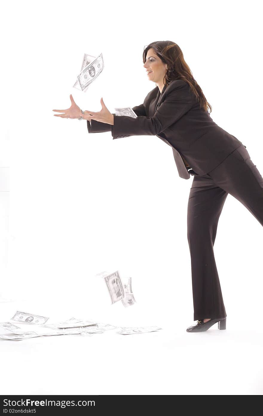 Woman in business suit catching money vertical