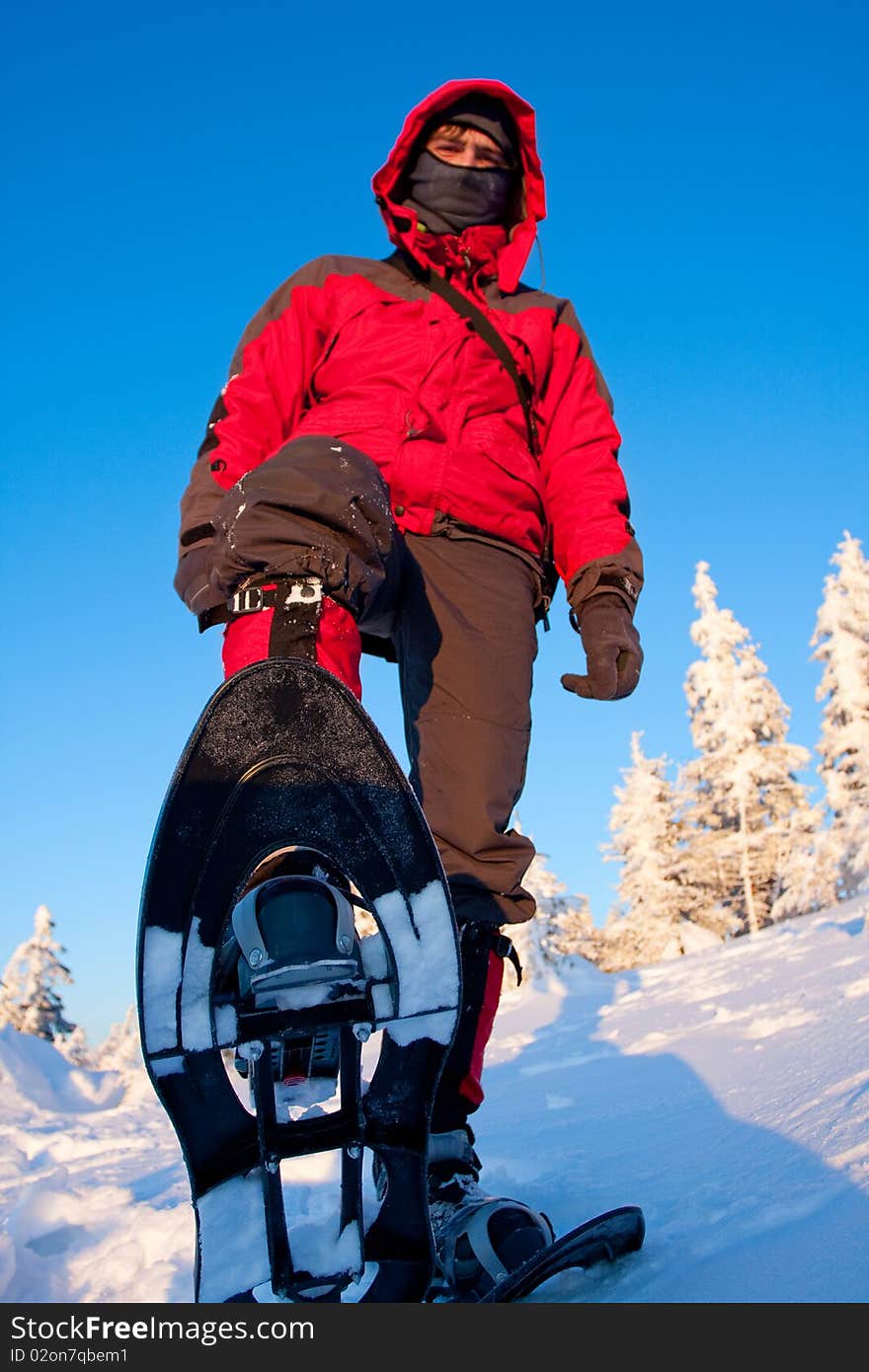 Hiker in winter in mountains