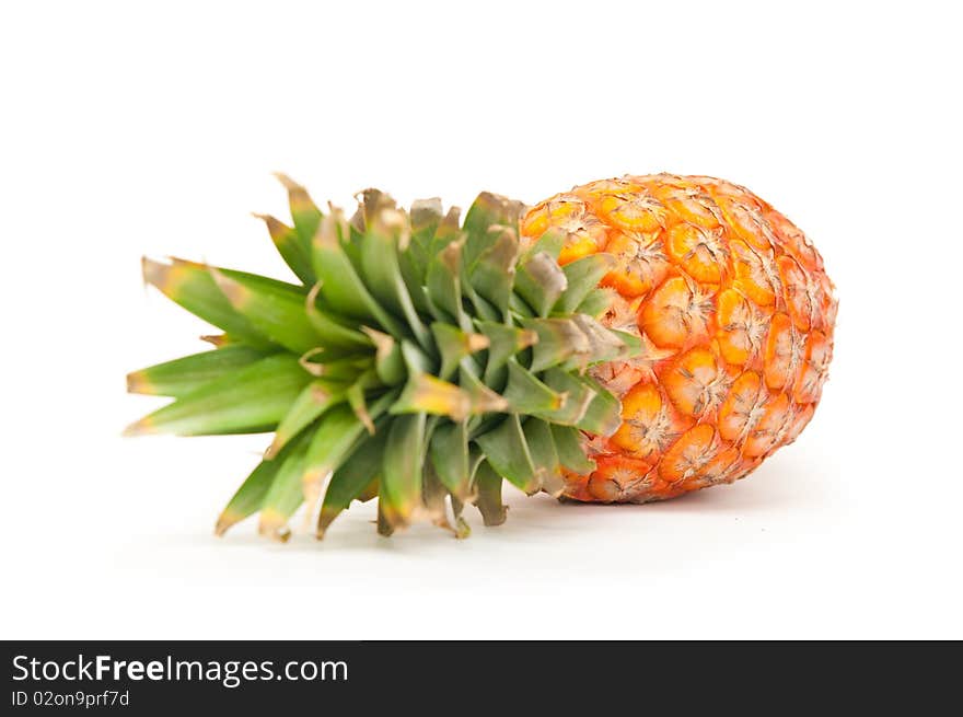 The image of ripe pineapple on a white background. The image of ripe pineapple on a white background