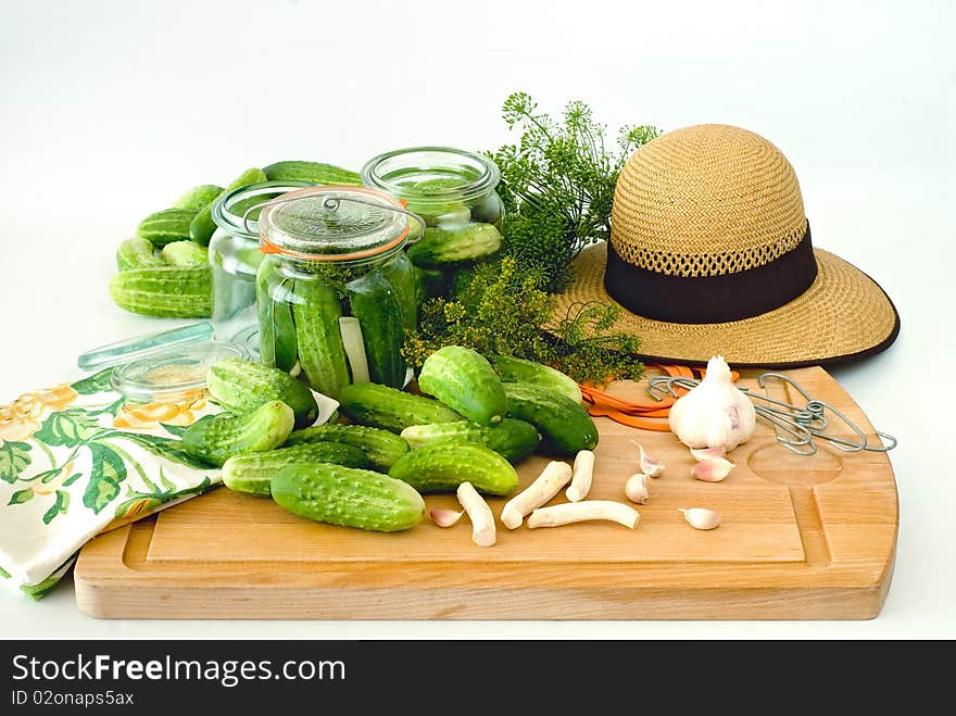 Fresh cucumbers prepared for pickling with the horseradish and the garlic. Fresh cucumbers prepared for pickling with the horseradish and the garlic