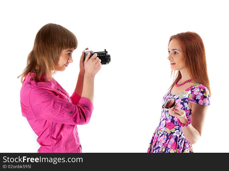 Two girls are taken pictures