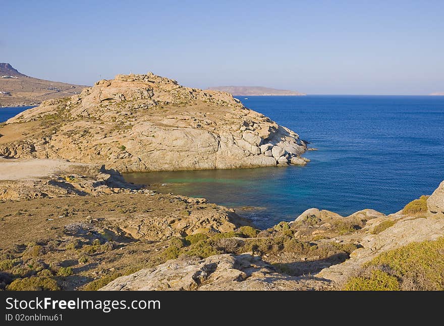 Cliffs Above The Azure-blue Sea On Islands