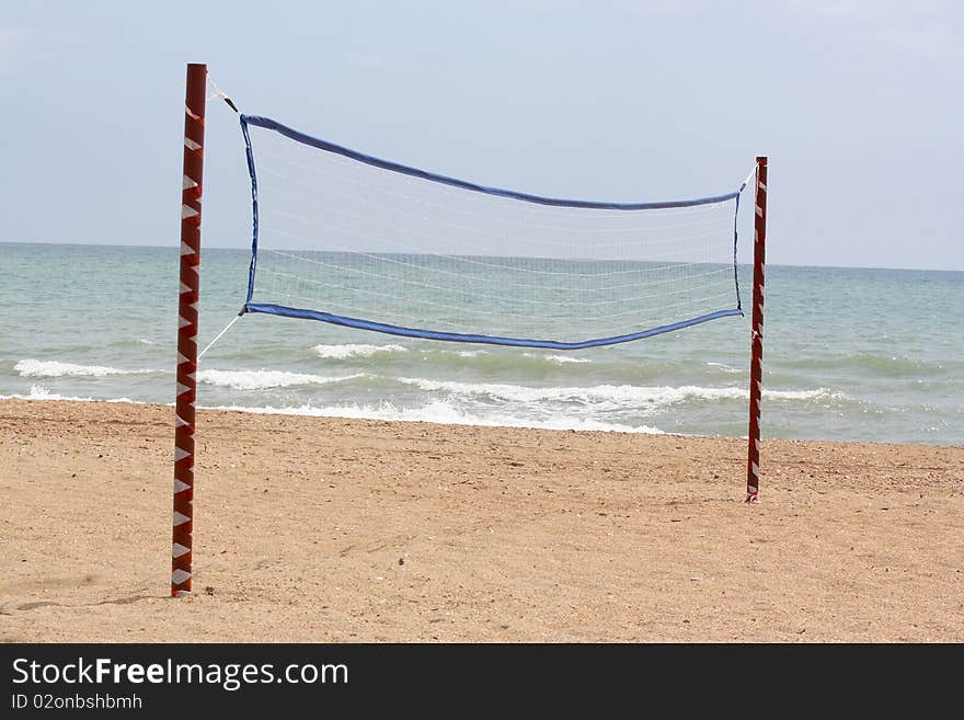 The image of volleyball net on a beach