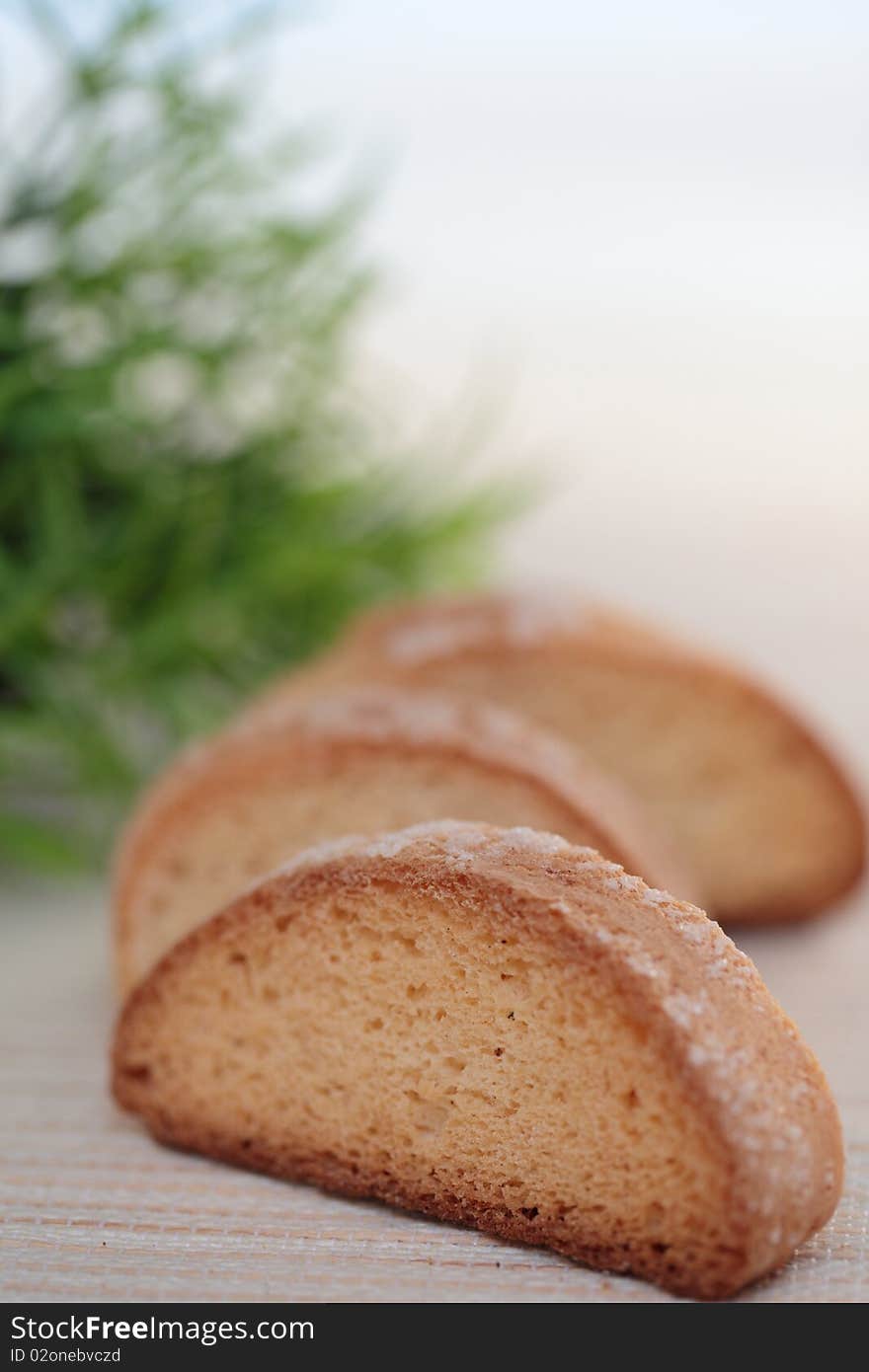 Three brown rusk on table. Three brown rusk on table