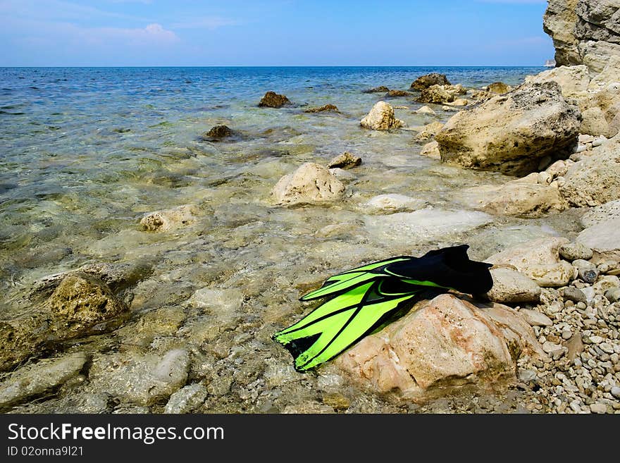 Scuba snorkeling green flippers set at seaside. Scuba snorkeling green flippers set at seaside