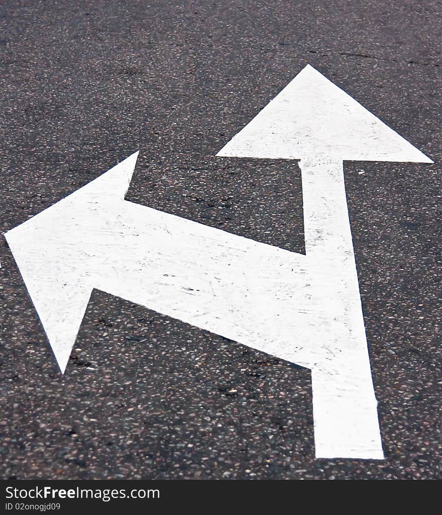 Road sign on asphalt surface