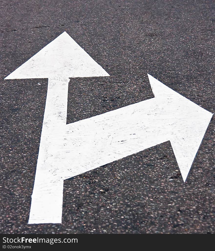 Road sign on asphalt surface