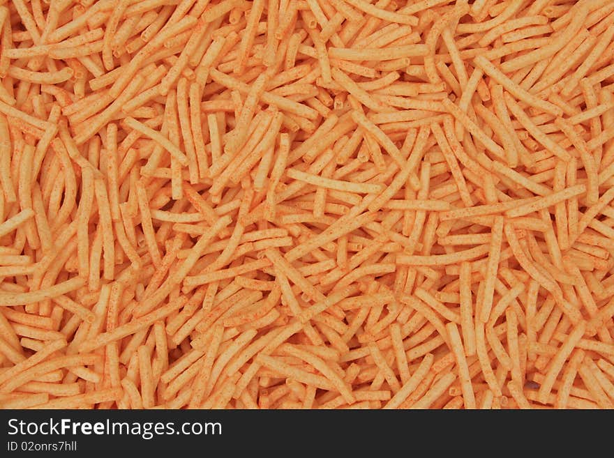 Background of orange cheese puffs