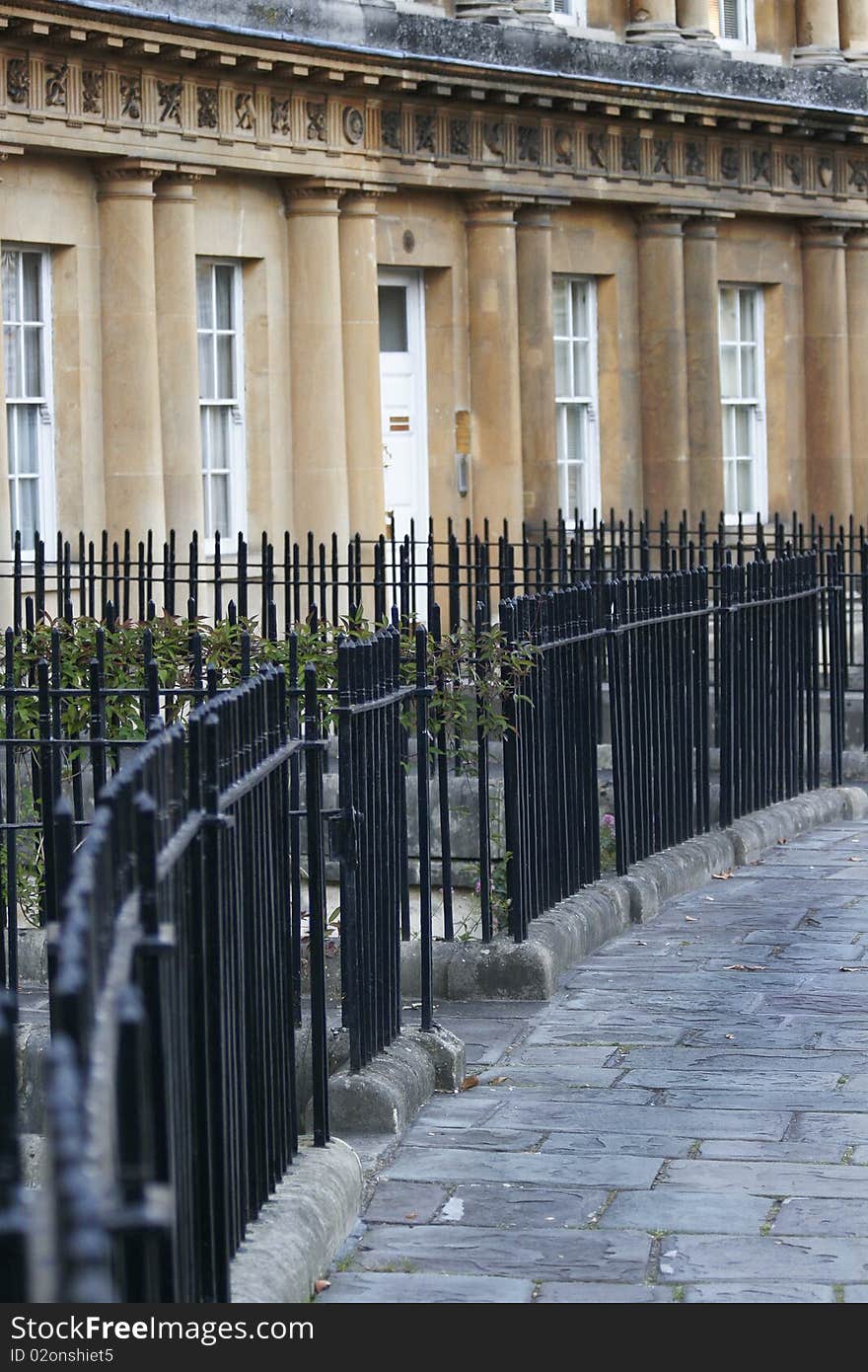 Curve of iron railings in front of Georgian facades in the Circus, Bath.