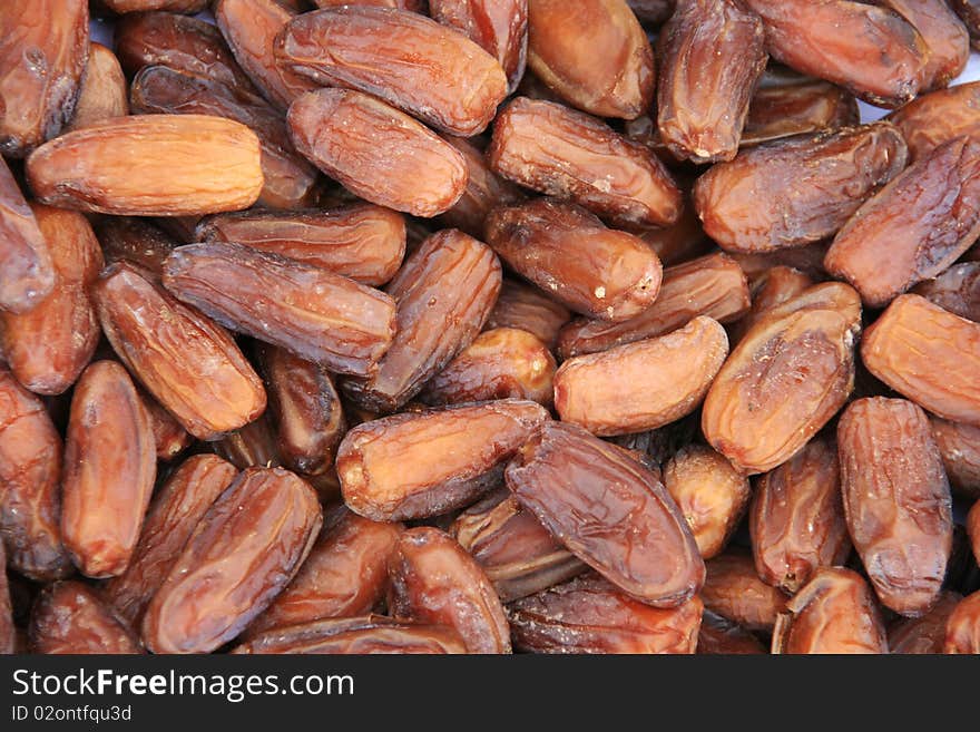 Background of brown dried dates. Background of brown dried dates