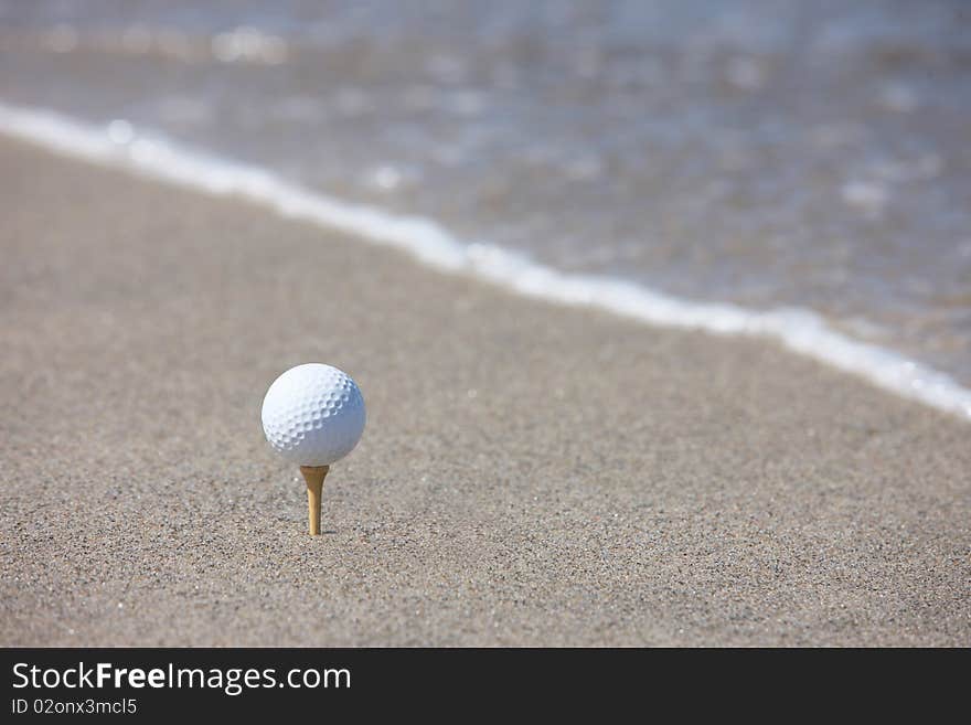 Golf ball in the beach